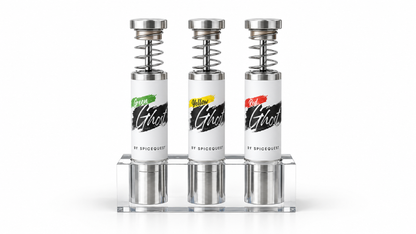Green, Yellow, and Red Ghost pepper grinders with silver tips in a clear acrylic stand